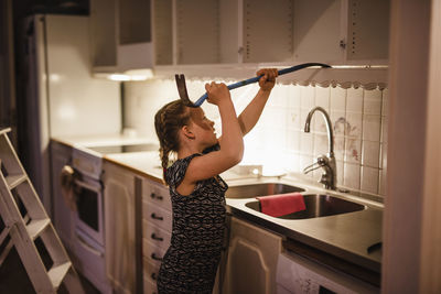 Woman standing at home