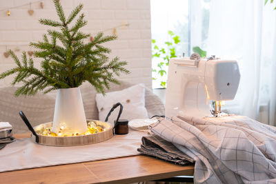 Close-up of sewing machine on table