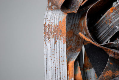 Close-up of rusty metal against gray background