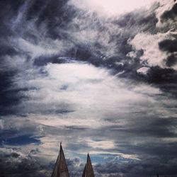 Low angle view of built structure against cloudy sky