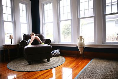 Man sitting on sofa at home