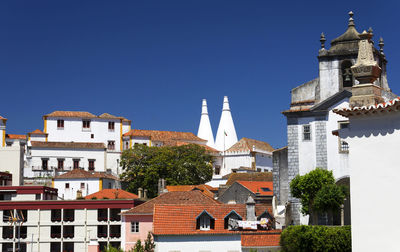 Low angle view of buildings against clear sky