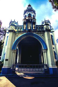 Low angle view of building against blue sky