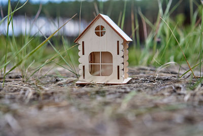 Close-up of small house on field