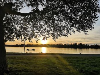 Scenic view of lake against sky during sunset