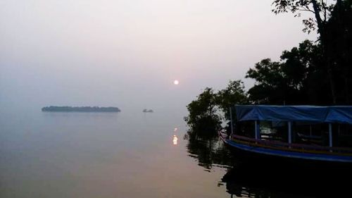 Scenic view of calm sea at sunset