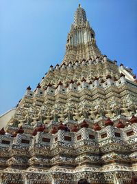 Low angle view of ornate building against sky