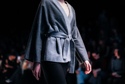 Fashion details of grey jacket with belt, women's casual wear