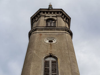 Low angle view of clock tower against sky