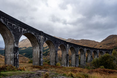 Arch bridge against sky