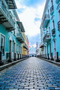 Cobbled street amidst residential buildings