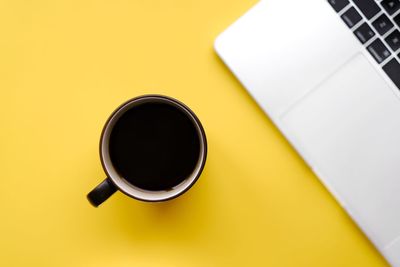 High angle view of coffee cup on table