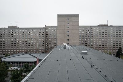 Buildings in city against clear sky