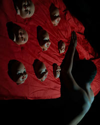 High angle view of people relaxing against black background