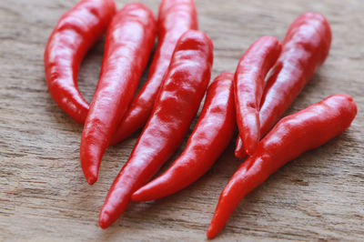 Close-up of red chili peppers on table