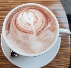 High angle view of cappuccino on table