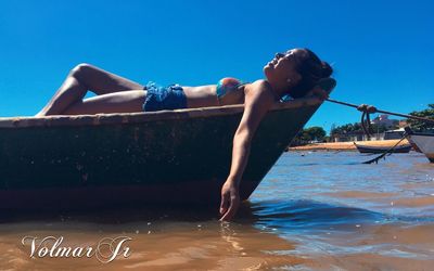 Side view of young woman in swimming pool