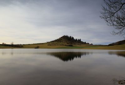 Scenic view of lake against sky during sunset