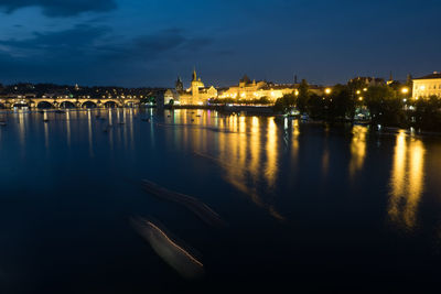 View of illuminated city at waterfront