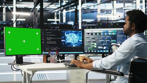 Midsection of woman using laptop at airport