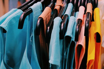 Close-up of clothes hanging at store