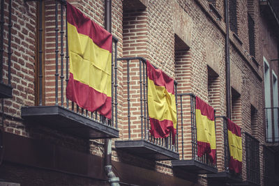 Low angle view of flag against building