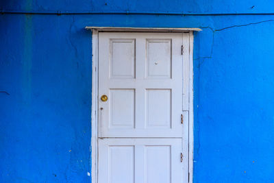 Close-up of closed blue door of building