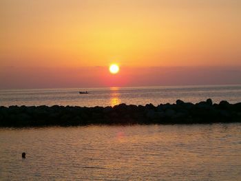 Scenic view of sea at sunset