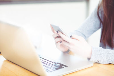 Close-up of woman using mobile phone