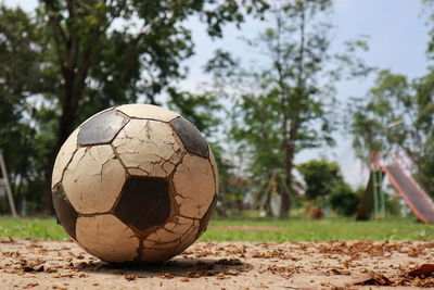 Close-up of soccer ball on field