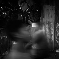 Blurred motion of people on street in city