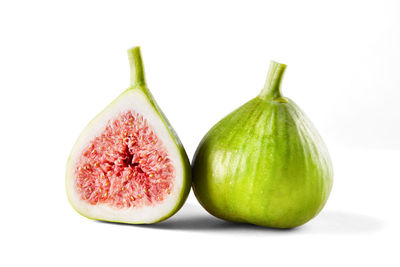 Close-up of fruits against white background