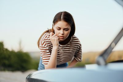 Side view of young woman looking away