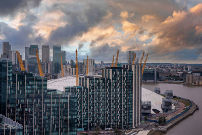 View from the river thames over millennium dome or o2 arena in london.