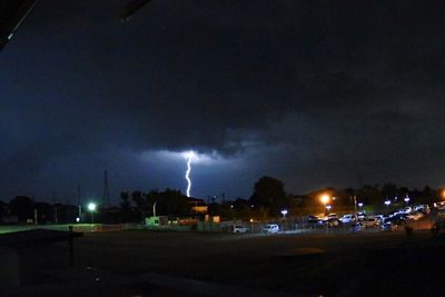 Storm clouds over city at night