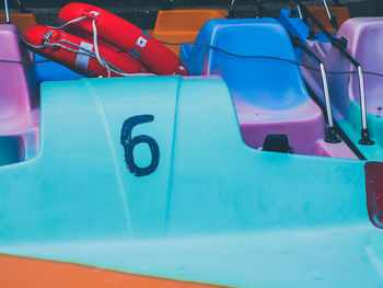 High angle view of multi colored chairs in swimming pool