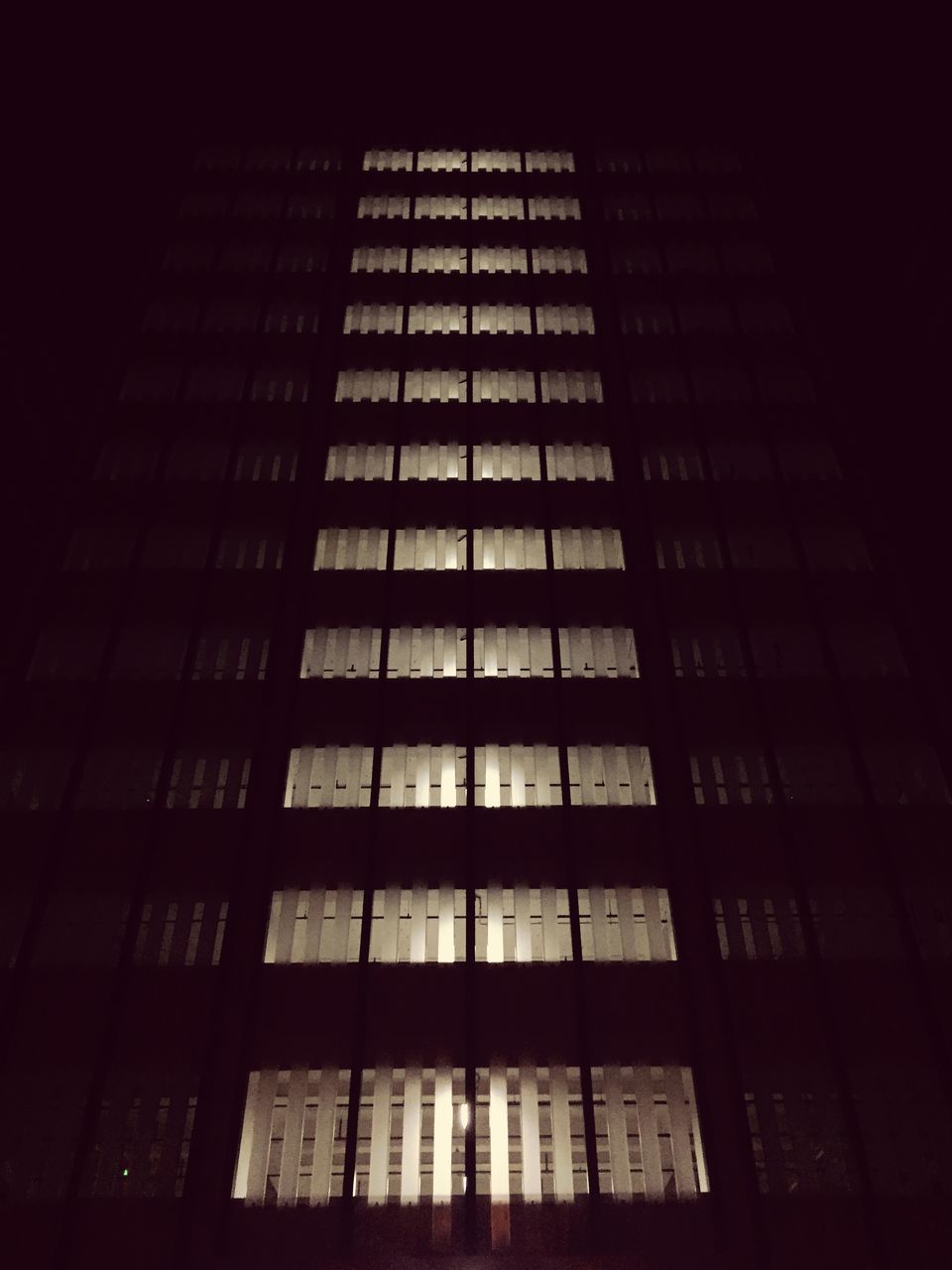 architecture, building exterior, built structure, low angle view, window, building, city, modern, office building, night, glass - material, illuminated, skyscraper, repetition, tall - high, no people, residential building, reflection, pattern, in a row