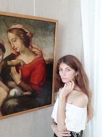 Portrait of young woman at home