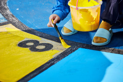 High angle view of man standing on table