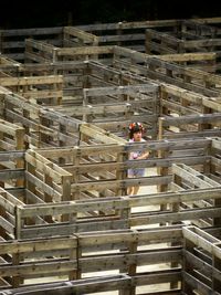 Girl in wooden maze