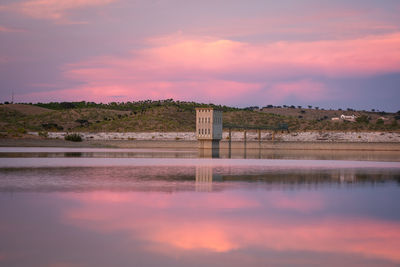 Scenic view of lake against sky during sunset