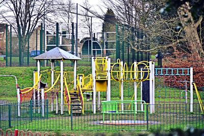 Playground in park against building