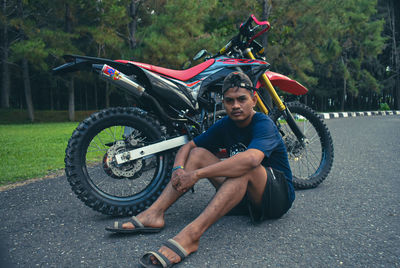 Portrait of smiling man riding motorcycle