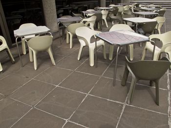 Empty chairs and tables in restaurant