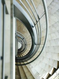 Directly above shot of empty spiral staircase in building