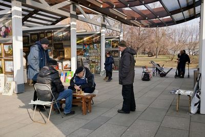 People at market stall