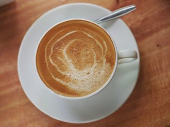 High angle view of cappuccino on table