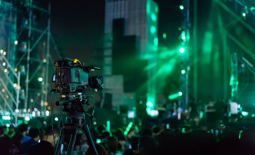 Camera against crowd at music concert