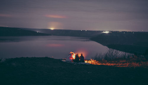 Scenic view of sea against sky at night