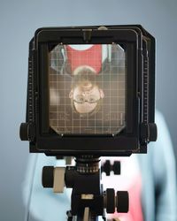 Upside down image of man seen on camera screen